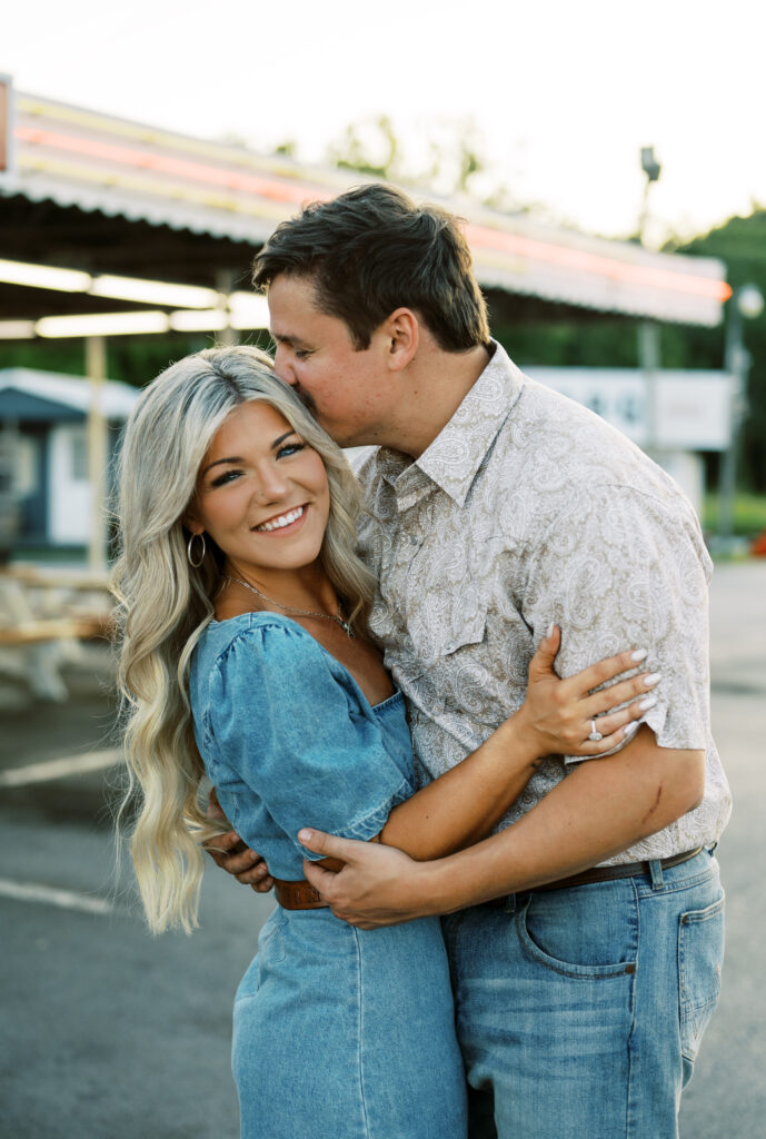 Engaged couple in front of drive in diner near nashville for engagement pictures