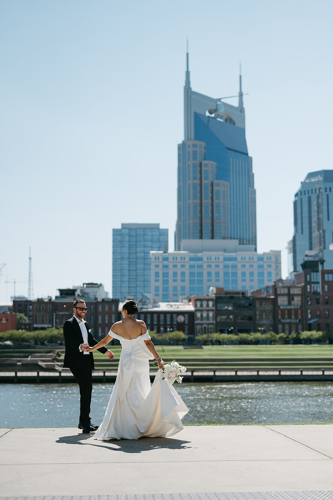 Newlyweds dance by Cumberland river in downtown Nashville