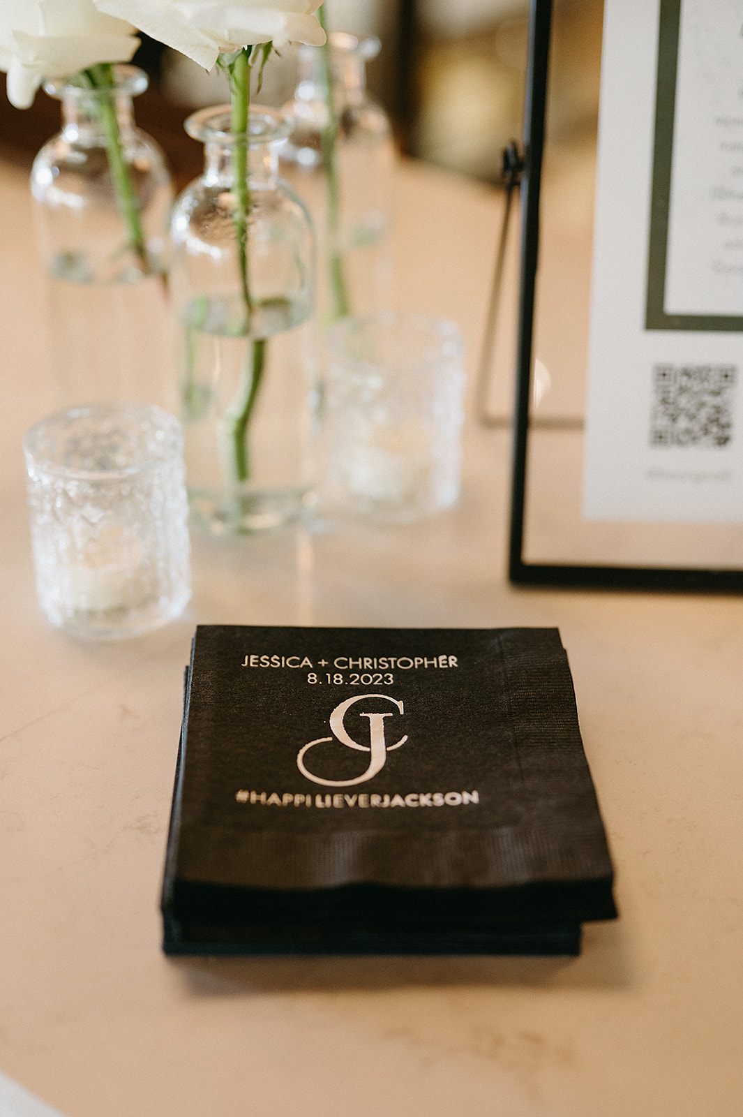 Details of custom printed napkins at the bar of a wedding
