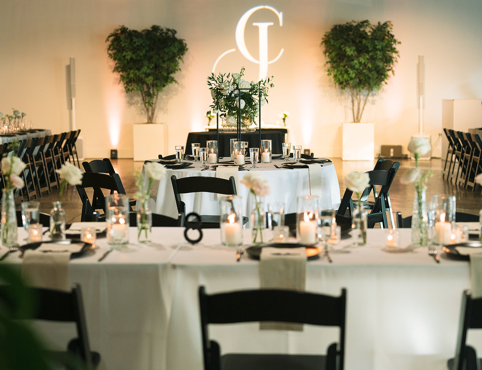 Saint Elle Wedding venue reception area setup with black chairs and white linens