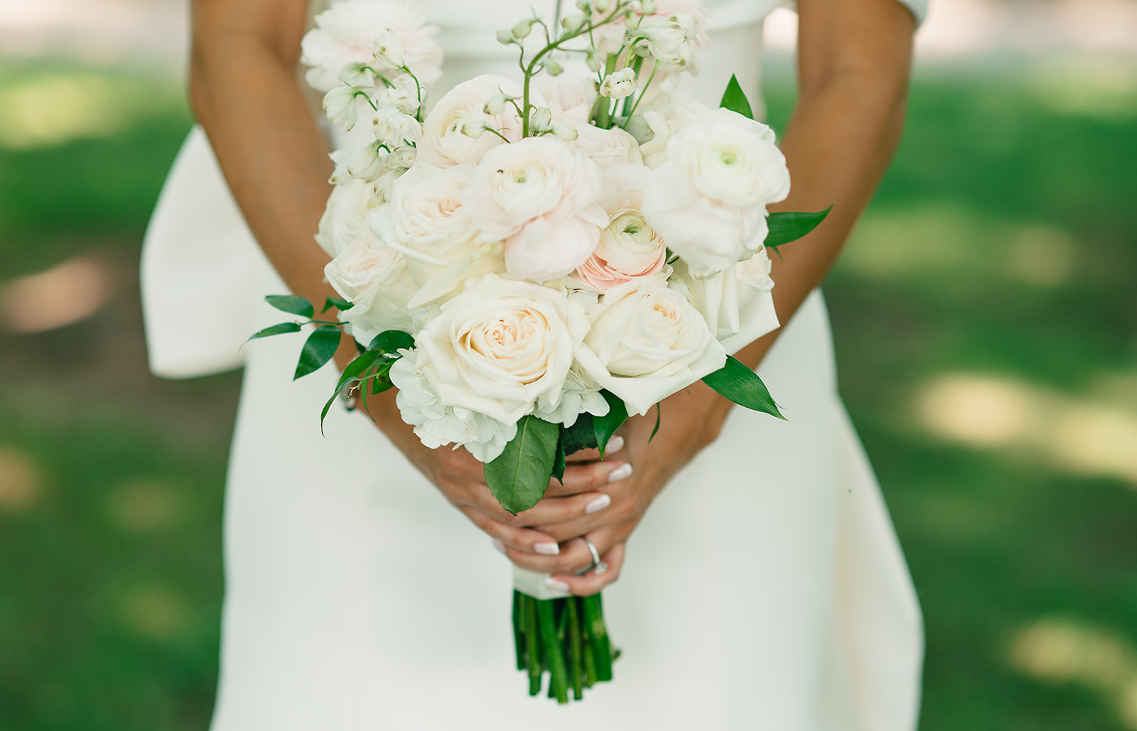 Details of a bride's white bouquet Saint Elle Wedding