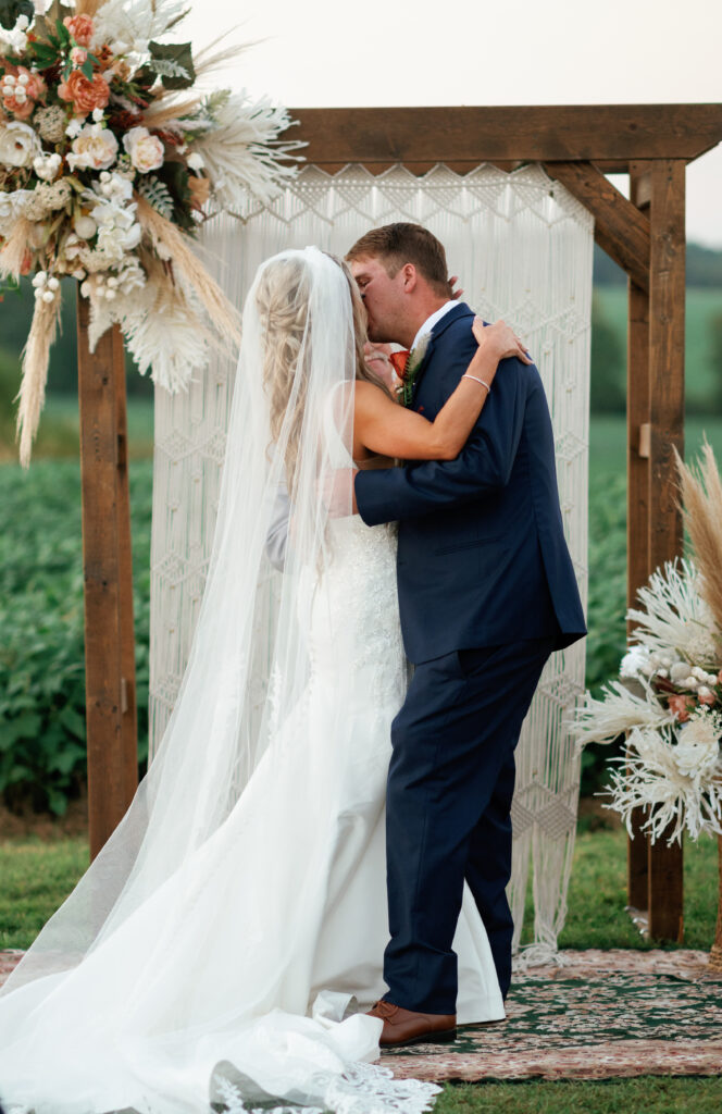 First kiss between bride and groom.