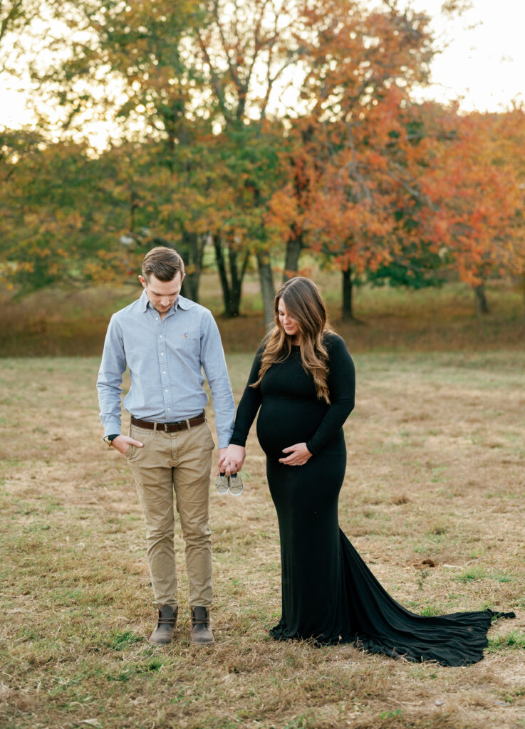 Expectant couple poses for maternity pictures near Nashville, Tennessee. 