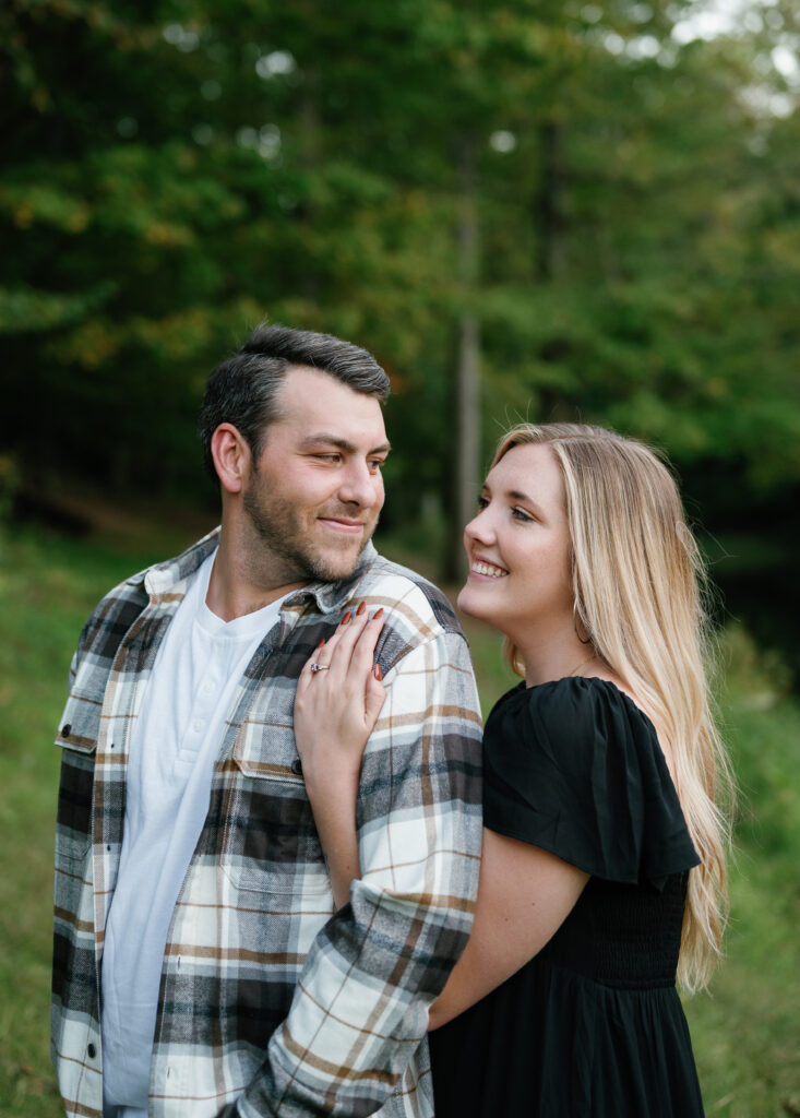 Couple posing in field for their Nashville Engagement pictures. 